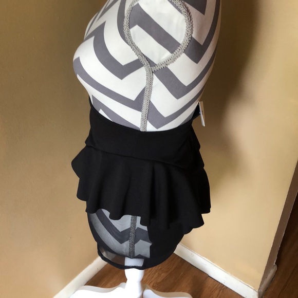 A black mini skirt with sheer sides. - Picture 4 of 4